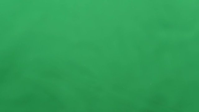 Nut mix fly up and down on a green background. Cooking healthy food with nut mix