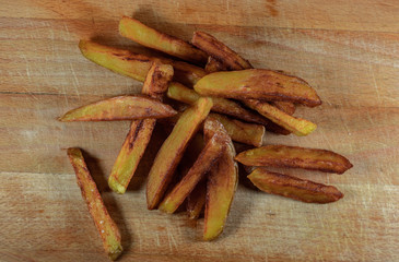 French Fries homemade on wooden background top view