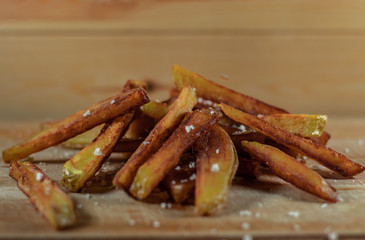 Homemade Salted French Fries On Wooden Background