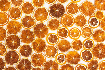Dried slices of various citrus fruits on white background