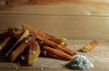 Homemade Salted French Fries On Wooden Background