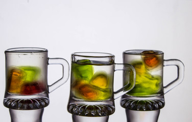 Unusual bright cocktail. Drink in a glass. The sun in the glass. Fire cocktail. Background.