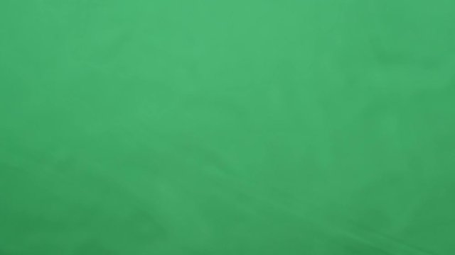 potato chips in free fall on a green background. Slow motion. Pringles