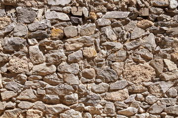 Stone wall on a street of Huancaya city at a sunny day in Lima Region, Peru