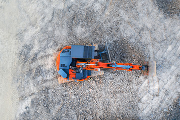 excavator on an construction site from above