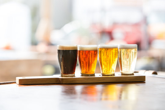 Beer Flight Tasting in Glasses on Plank