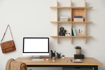 Stylish room interior with modern comfortable workplace