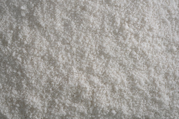 Fototapeta na wymiar Background of sea salt, grains of salt crystals production. Heap of coarse salt