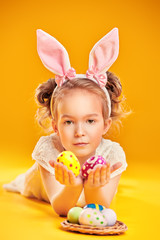 Obraz na płótnie Canvas Easter girl with eggs