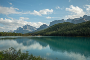 Naklejka na ściany i meble Image of lake in the mountains with reflection