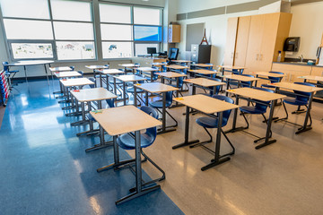 Interior of a bright, empty school classroom: back to school concept, coronavirus concept