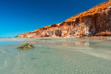 Colorful sand cliffs at the paradisiacal Praia de Vila Nova, Icapui, Ceara, Brazil on September 6,...