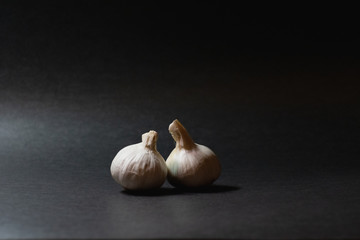Garlic on black background
