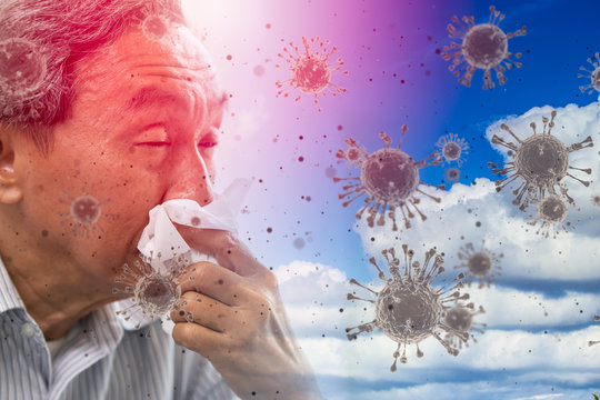 Asian elder ill sneezing coughing with spread of corona virus Covid-19 or covidvirus flow in the air concept.