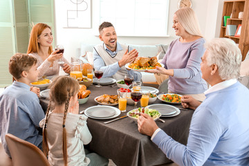 Family celebrating Thanksgiving Day at home