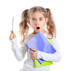 Surprised little schoolgirl on white background