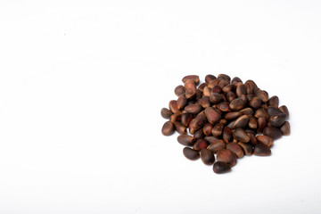Fresh peeled cedar nuts isolated on white background, closeup