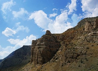 Fototapeta premium Buttes and geologic formations seen along the road from North Fork Highway in Wyoming.