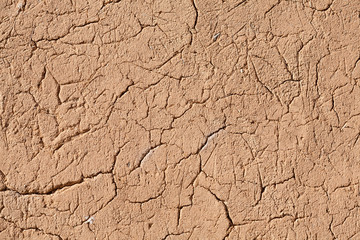 Detail of a cracked clay wall