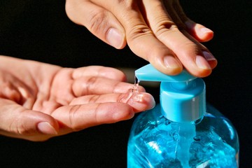 Health concept, young woman's hand is cleaning hands with alcohol gel To get rid of various germs and viruses.