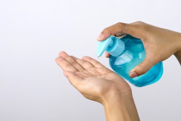 Health concept, young woman's hand is cleaning hands with alcohol gel To get rid of various germs and viruses.