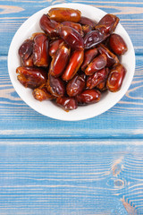 Dates containing natural vitamins and dietary fiber, healthy nutrition concept, copy space for text