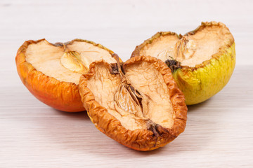 Old moldy apple, unhealthy and disgusting fruit