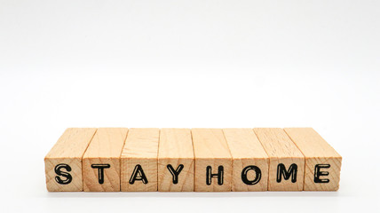 Wooden Text Block of "STAY HOME" on Isolated Background