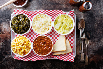 Classic southern bbq sides with beans, cole slaw, mac and cheese and collard greens