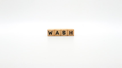 Wooden Text Block of "WASH" on Isolated Background