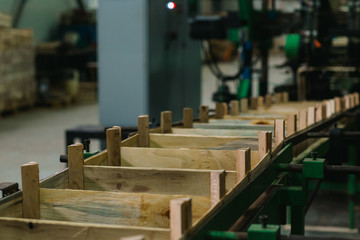 conveyor for the production of wooden boxes for storing fruits and vegetables. woodworking factory for the production of boxes. wooden box making machine