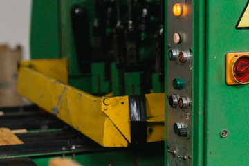 industrial conveyor for the production of wooden boxes for storing fruits and vegetables. industrial machine for the production of wooden boxes. machine tool in a factory