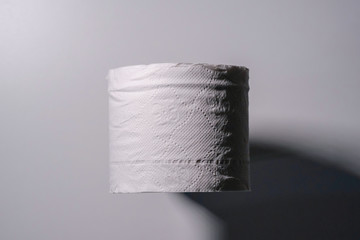 One roll of toilet paper with isolated white background. Toilet rolls become precious during the coronavirus season.
