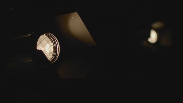 Opening The Lights Of The Barndoors With Moving Leaves On The Dark Surroundings. -medium shot