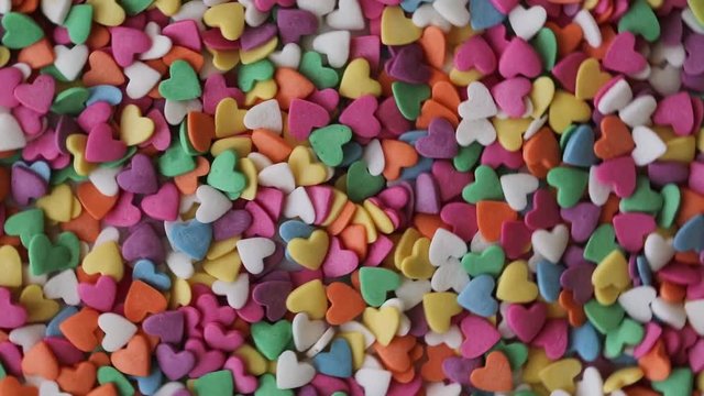 Heart shaped sugar candy sprinkles from above. Colorful sprinkles sugar candy.  