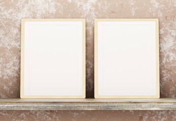 Fototapeta premium Template with two blank frames on a shelf against a concrete wall. Two blank posters for photos and inscriptions. 3D rendering.