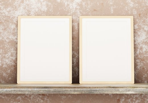 Template with two blank frames on a shelf against a concrete wall. Two blank posters for photos and inscriptions. 3D rendering.