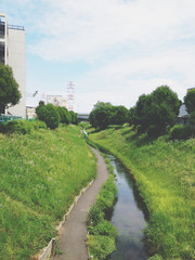 A landscape with a waterway in the Hokkaido countryside