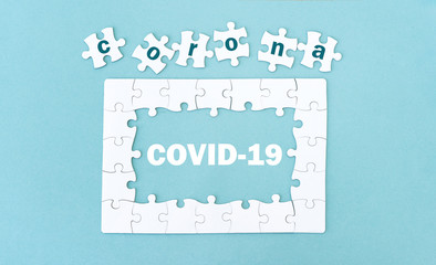 Top view of jigsaw puzzle with pieces, coronavirus
