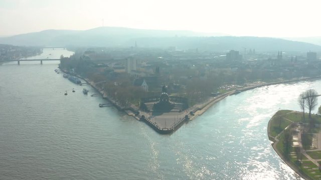 Deutsches Eck german corner in Koblenz with the monument statue of the  Kaiser Emperor Wilhelm I with the river rhine and the estuary of the river mosel aeiral drone panaorama shot 4K 30p