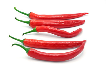 Five fresh juicy peppers isolated on a white background