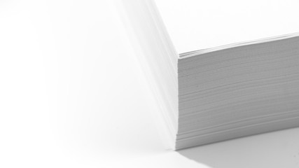 Stack of white office paper on light background, top view, place for text.
