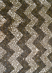 Traditional black and white pebble floor in Greece.