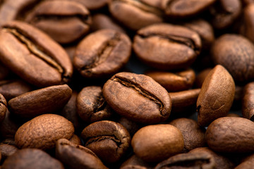 Coffee beans close-up background. Fresh roasted