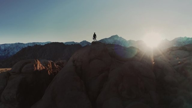 Violinist Playing on Rock, Death Valley Landscape Aerial Shot Flare of the Sun