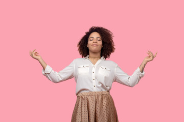 Woman with closed eyes arms to the sides.