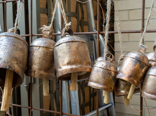 Lantern gong style bells hanging by string on wall