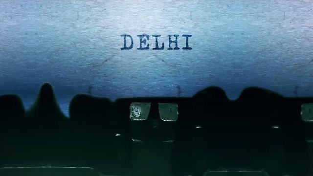 delhi Word closeup Being Typing and Centered on a Sheet of paper on old vintage Typewriter mechanical 4k Footage Background Animation.