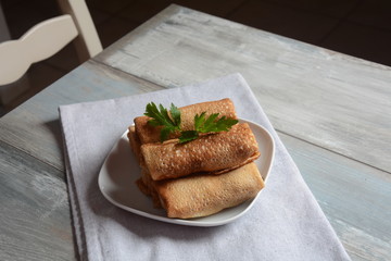 Cabbage rolls stuffed with ground beef and rice in tomato sauce