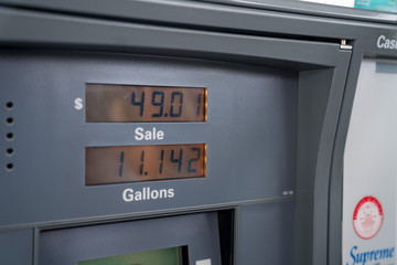 Close up of gas station pump with gallons and dollar amount